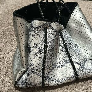 Silver and black Neoprene bag with small zippered pouch
